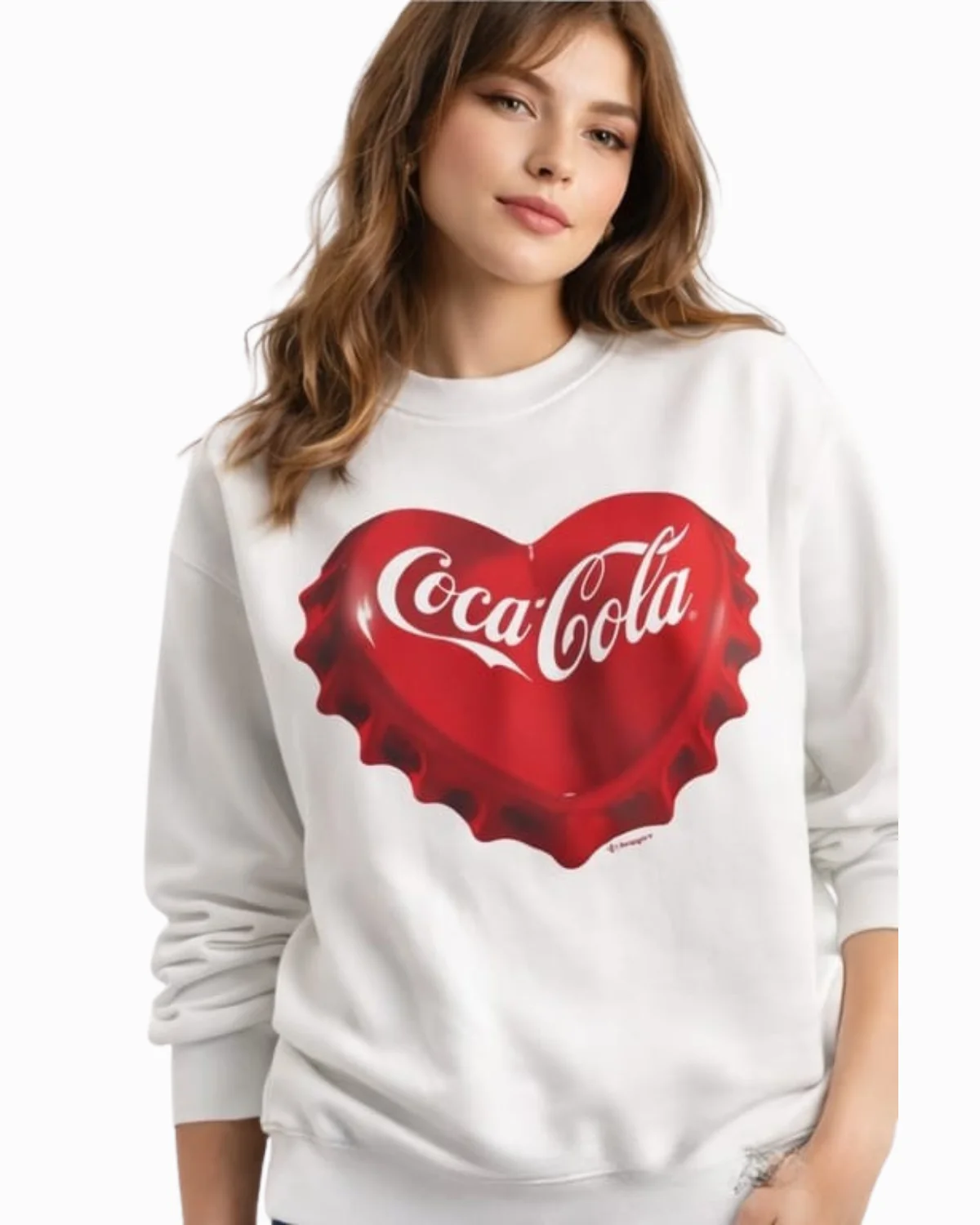 Bold Coca-Cola heart graphic on a soft